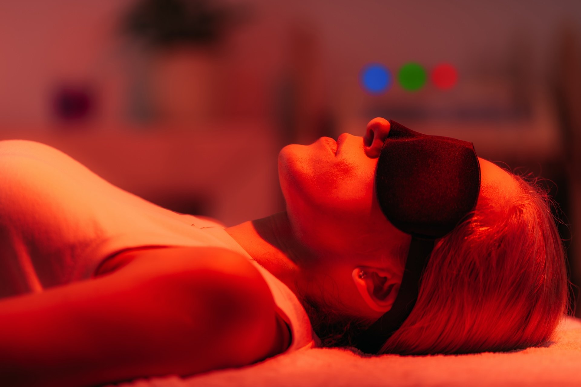 Person relaxing during a red light therapy session